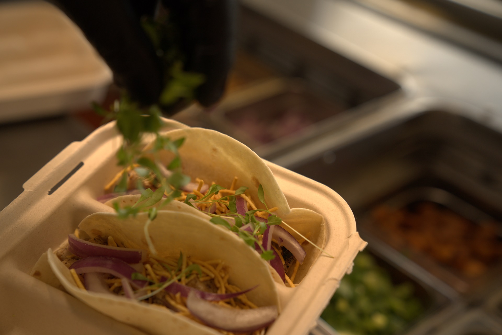 Fast casual catering setup at Balance Grille with customizable bowls prepared for a group event.
