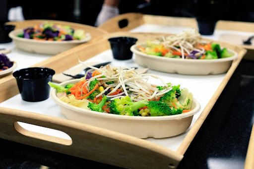 A tray filled with vibrant, fresh vegetable salads and sauces at Balance Grille in Sylvania.