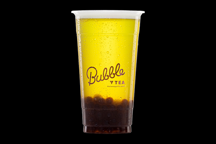 Green apple-flavored bubble tea with rainbow bubbles at Balance Grille in Ohio.