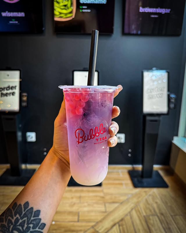 Man holding a Balance Grille bubble tea in Cleveland, representing healthy, on-the-go refreshment.