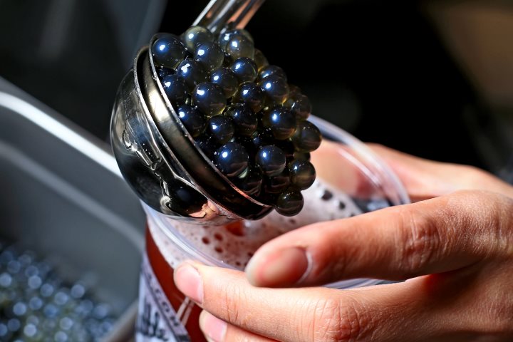 Tapioca pearls being added to a creamy milk tea at Balance Grille in Perrysburg, Ohio.